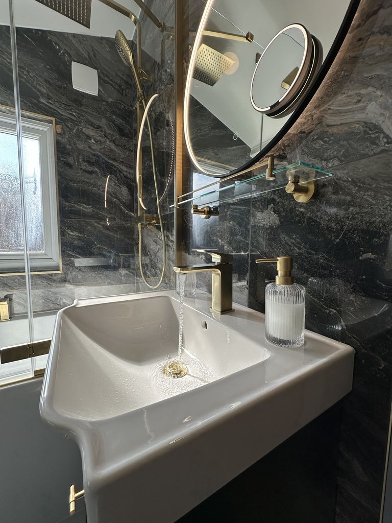 Roper Rhodes vanity closeup LED loop mirror with brass fixtures family bathroom Braintree CM7