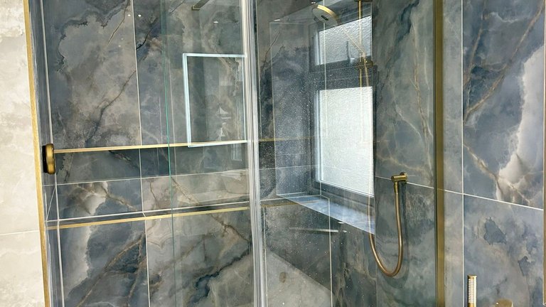 Crosswater wetroom glass with infinity niche and tileable linear waste Brentwood CM13 luxury bathroom