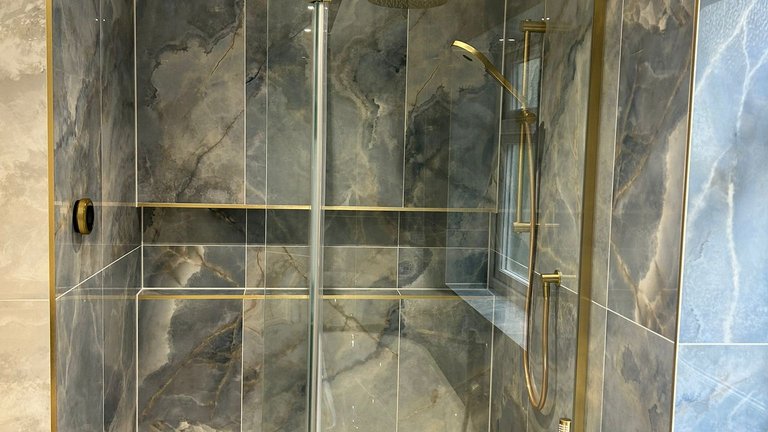 Wetroom shower with blue onyx tiles and Elisa Intuition shower kit in brushed brass Brentwood CM13