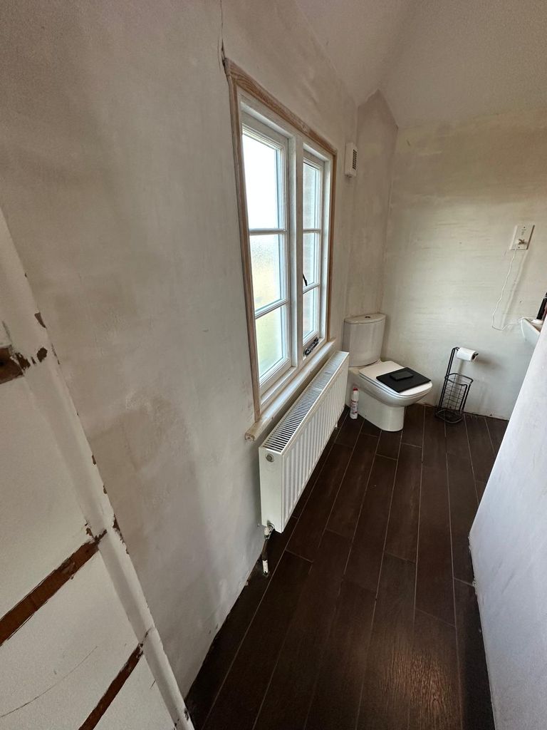 Toilet and window wall before renovation, heritage rectory bathroom Great Saling CM7 Essex